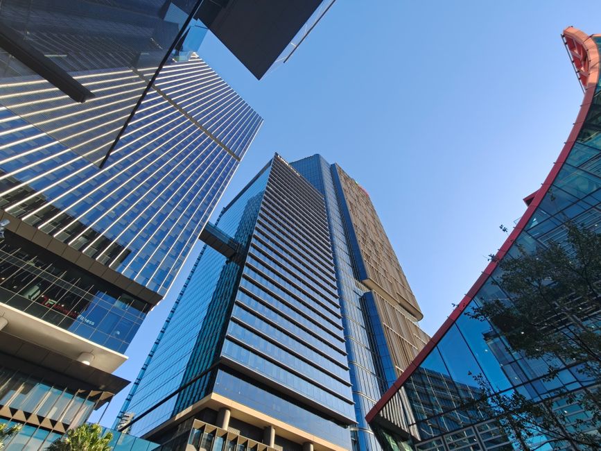 A striking view of modern skyscrapers in Parramatta CBD, Australia, under a clear blue sky.