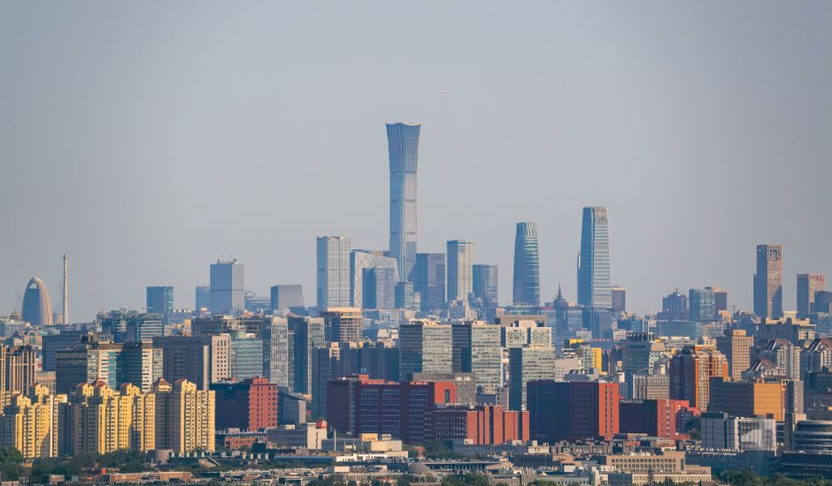 Aerial view of Beijing's skyline showcasing the Central Business District's skyscrapers on a clear day.