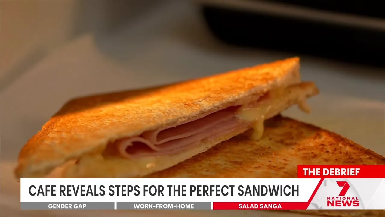 close-up of a toasted ham and cheese sandwich with melted cheese